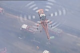 Helicopter and truck crews battling the Hazelwood open cut mine fire which burnt for 45 days from February 9, 2014.