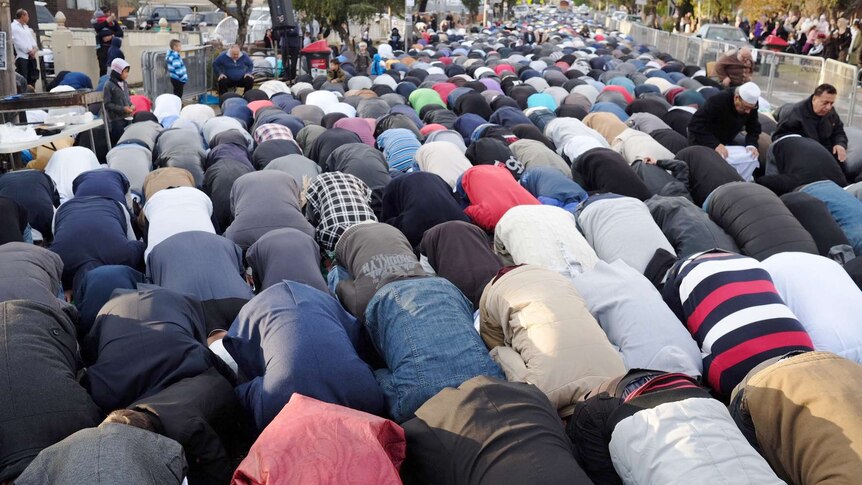 Thousands of Muslims pray in the streets of Lakemba