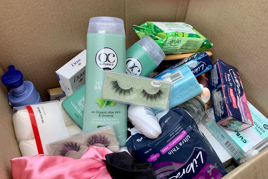 A box of face cream, sanitary items and other women's health productions, Broome, January 2023.