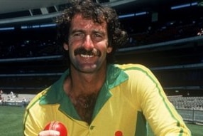 Australian cricketer Dennis Lillee poses for a photo holding a cricket ball.