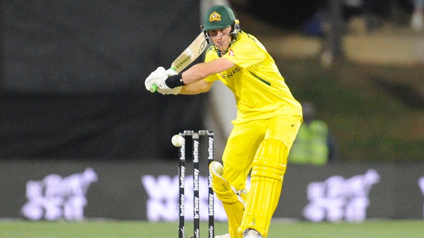 An Australian male batter prepares to hit the ball in an ODI against South Africa.