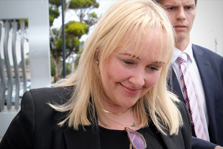 A close-up photo of a lawyer outside court.