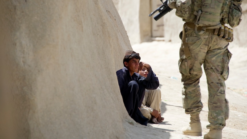 Afghan child and US soldier in Afghanistan