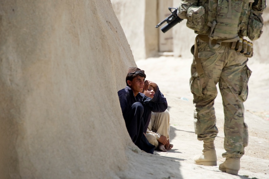 Afghan child and US soldier in Afghanistan