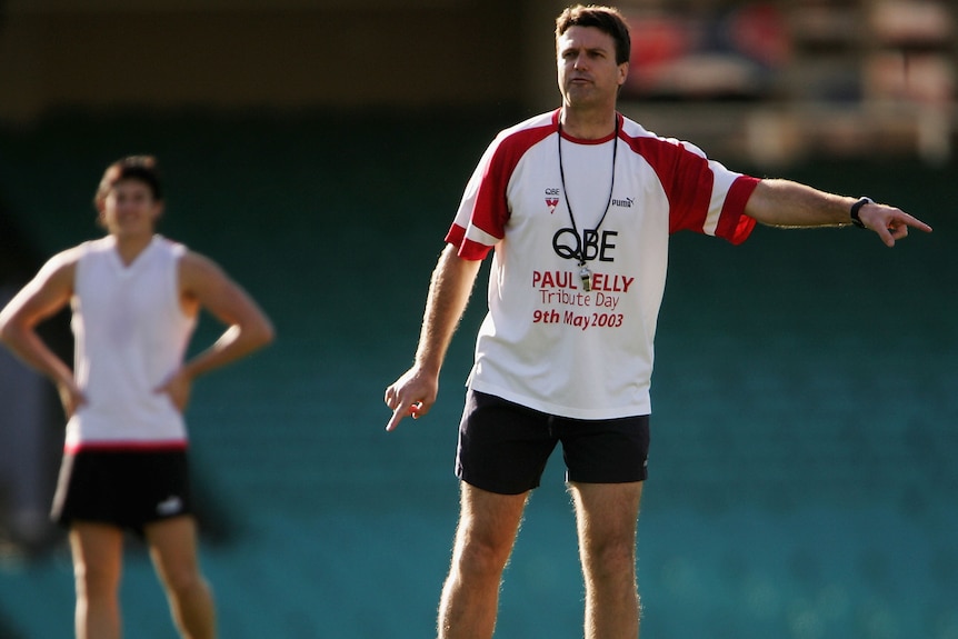 Paul Roos points while training the Sydney Swans.
