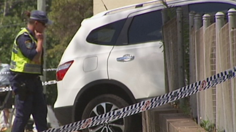 Police inspect the 4WD vehicle which ran over and killed a six-year-old boy in Carlingford in December 2013