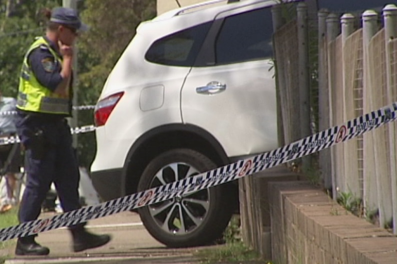 Police inspect the 4WD vehicle which ran over and killed a six-year-old boy in Carlingford in December 2013
