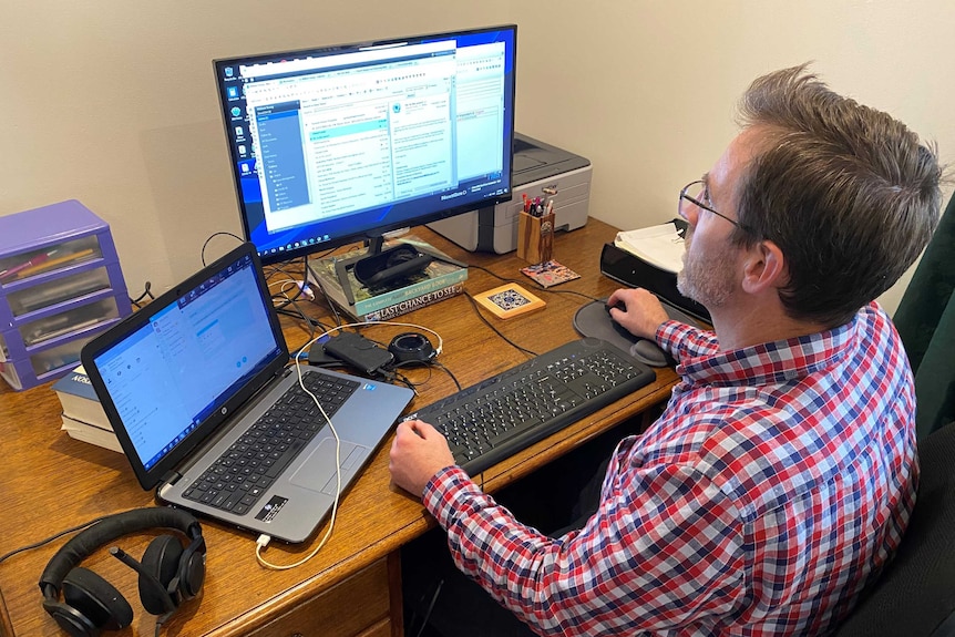 William Young at his desk