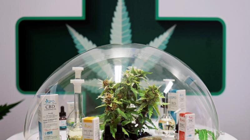 Cannabis oil products made in Thailand are seen on display in a glass dome.