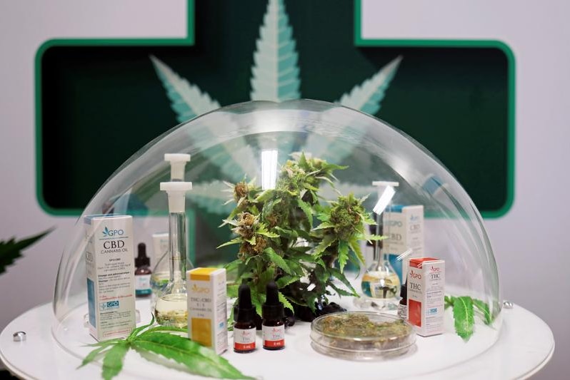 Cannabis oil products made in Thailand are seen on display in a glass dome.