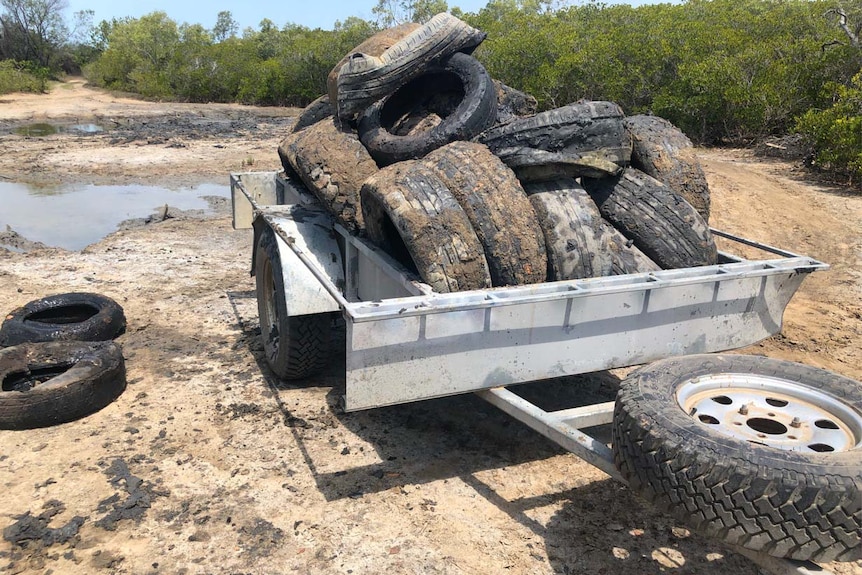 A trailer of muddy tyres 