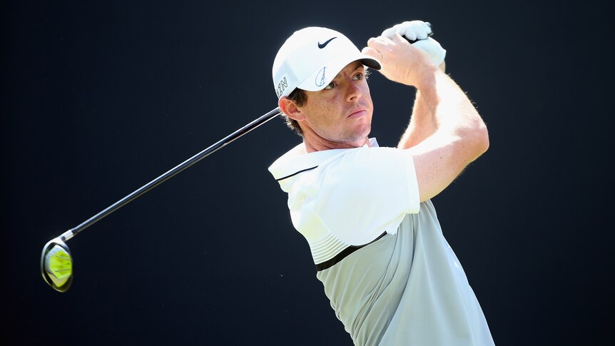 Rory McIlroy of Northern Ireland hits his tee-shot on the third hole