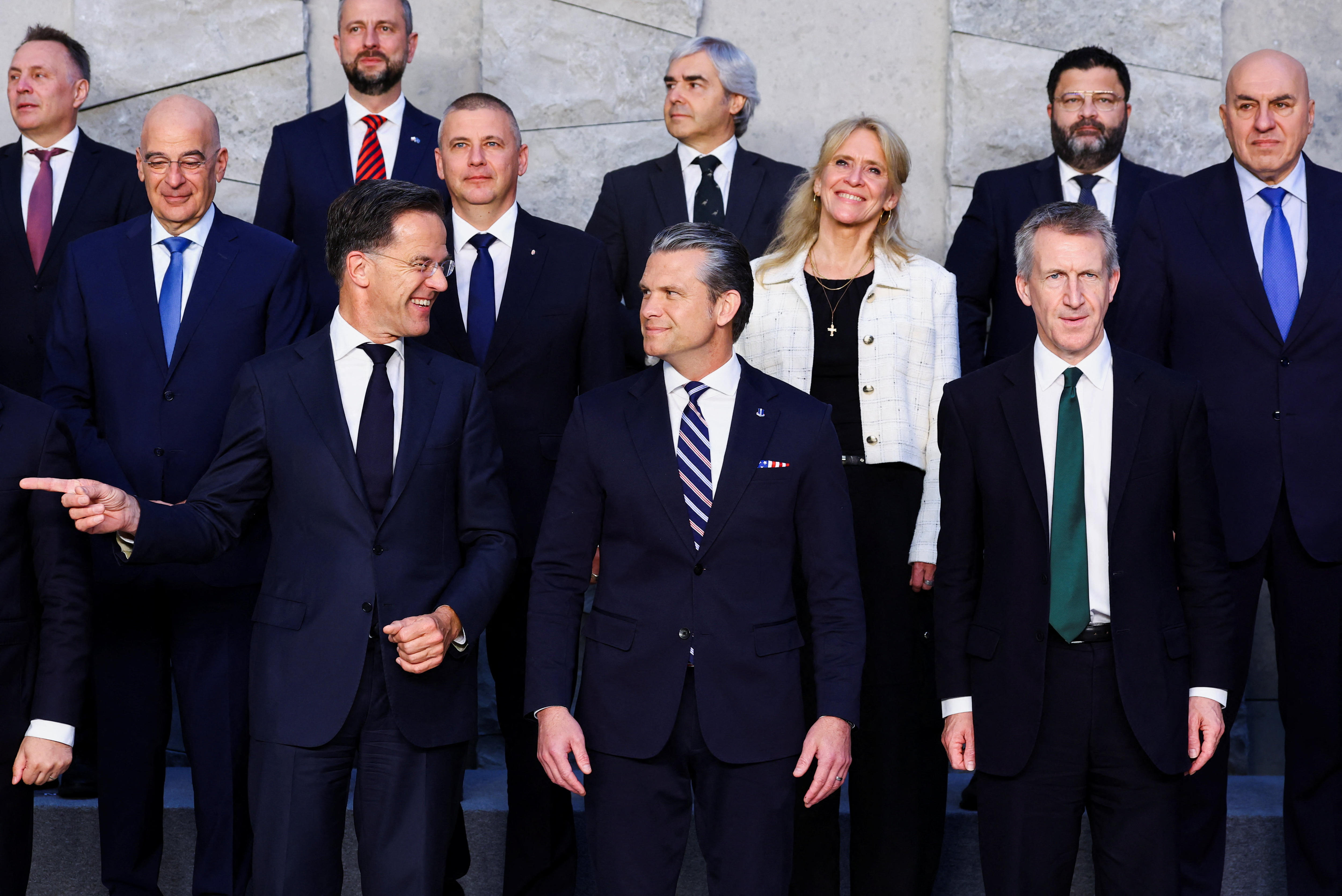 Mark Rutte gestures next to Pete Hegseth and other world defence ministers