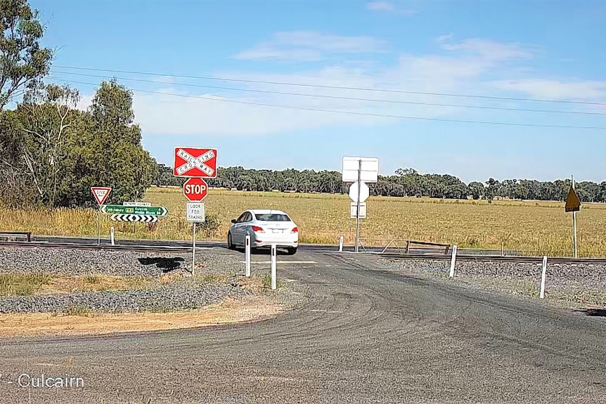 Camera vision of a car going over the Culcairn rail crossing 