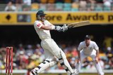 Mike Hussey plays a pull shot on his way to an unbeaten 81 at the Gabba.