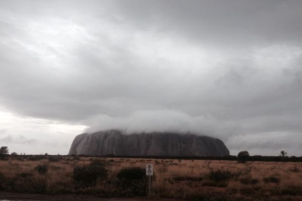 Storm clouds hover over Uluru
