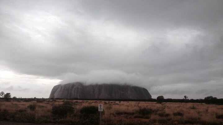 Storm clouds hover over Uluru