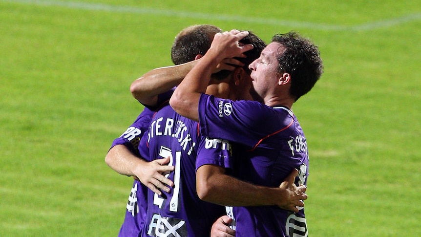 Glorious night out ... Steven McGarry and Robbie Fowler congratulate Mile Sterjovski on scoring in the first half.