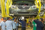 Holden workers assemble a VF Commodore at Elizabeth in South Australia.