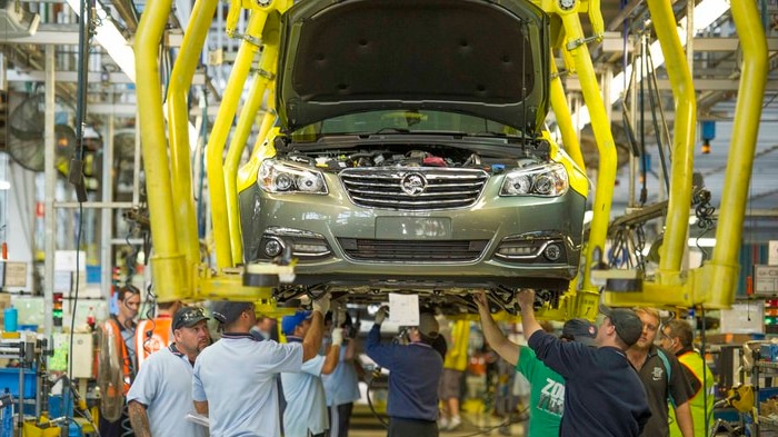 Holden workers assemble a VF Commodore at Elizabeth in South Australia.