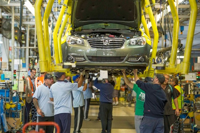 Holden workers assemble a VF Commodore at Elizabeth in South Australia.