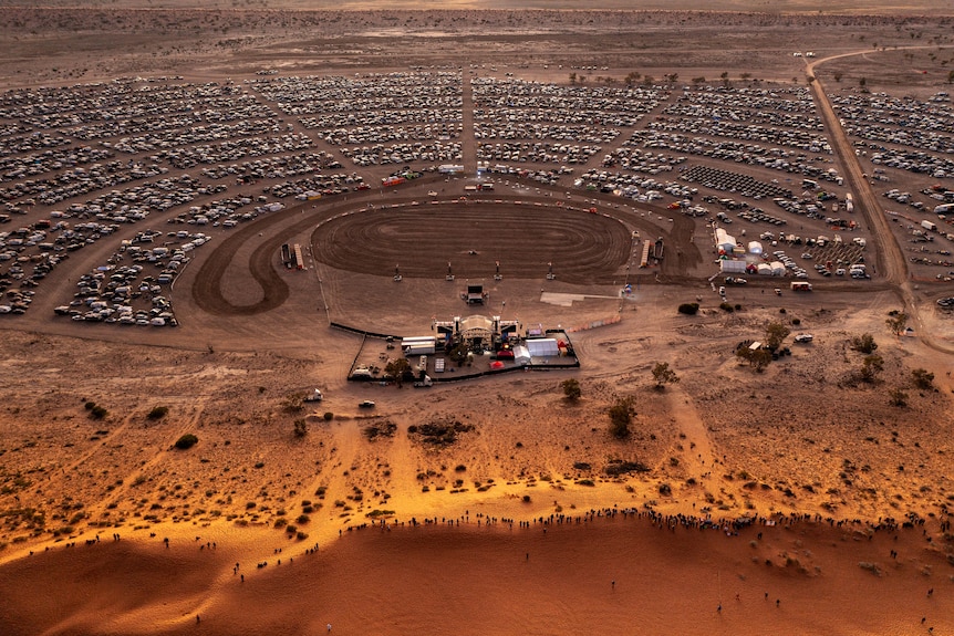 An aerial view of an outback music festival held in the desert