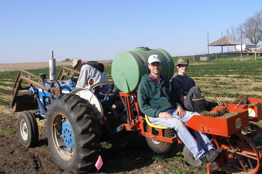 Three generations of De Reus family on the farm