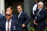 Hunter Biden, wearing suits, departs federal court after a plea hearing 