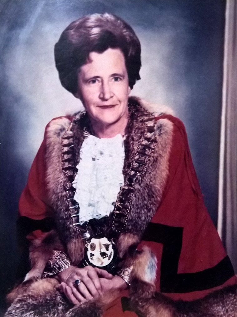 Black and white photo of woman wearing elaborate mayoral robes