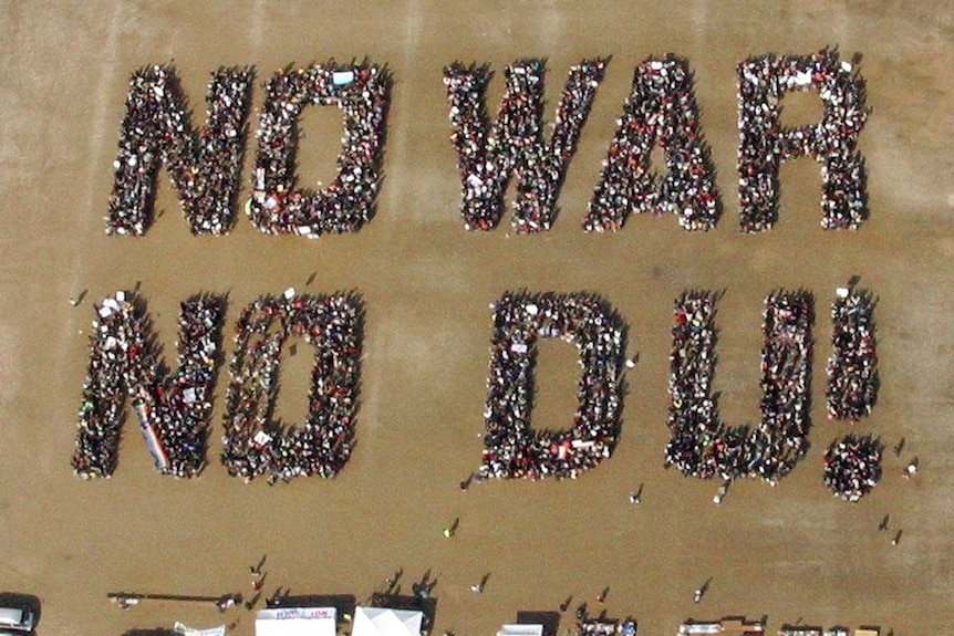 Birds eye view of human protesters shaped to say no war no du 