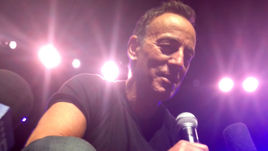 The Boss croons into his microphone during a performance at the Perth Arena on February 5, 2014