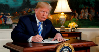 Donald Trump signs an executive order in the white house