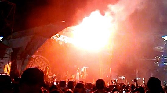 Flare burns crowd members