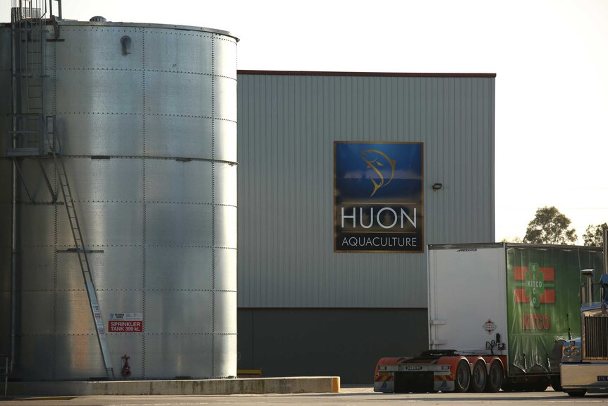 A factory with a sign saying Huon Aquaculture.