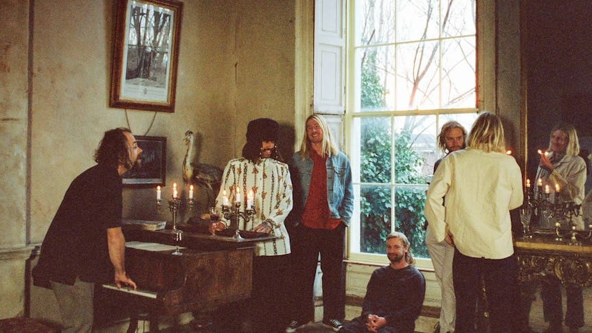 Photograph of the entire Ocean Alley band members in a room.