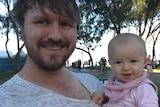 Patrick Williams holding his 9-month-old daughter Piper Williams