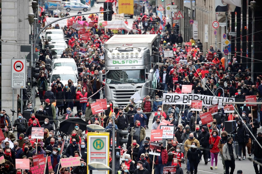 Protesters crowd a Berlin street, they are against a new lockdown in Germany.