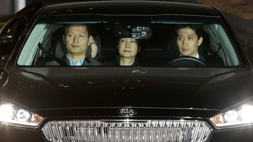 Park Geun-hye leaves the prosecutors' office as she is transferred to a detention house in Seoul.