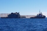 ex_HMAS Tobruk on its side in the ocean
