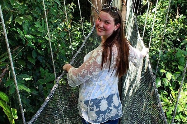 Jarrah McLardy standing on a bridge in a mountain climb in Malaysia.