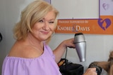 Sonia Colvin blow-dries the hair of a client at her Bribie Island salon.