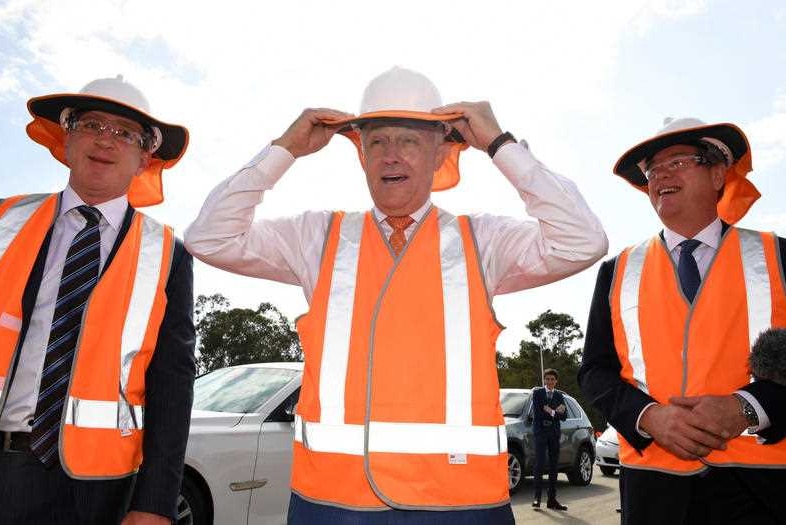 Mr Turnbull walks with Mr Howarth and Mr Nicholls.