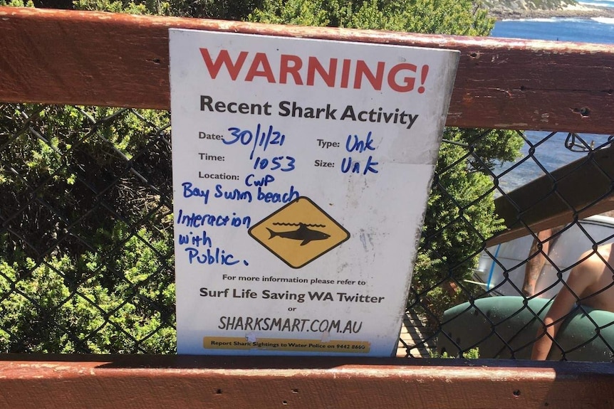 A warning sign erected off a beach at Gracetown where it is believed a female swimmer was bitten on the foot by a shark.