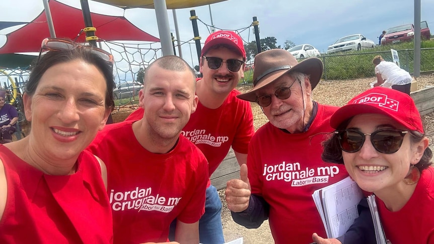 A group of people wearing red shirts, including Labor MP Jordan Crugnale.