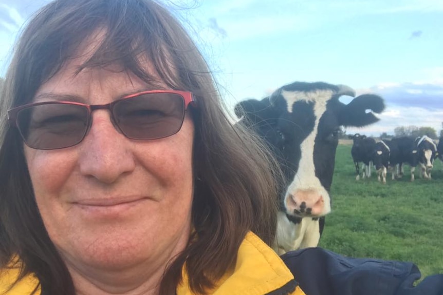 Dianne Bowles pictured with one of her dairy cows in Mead, Victoria