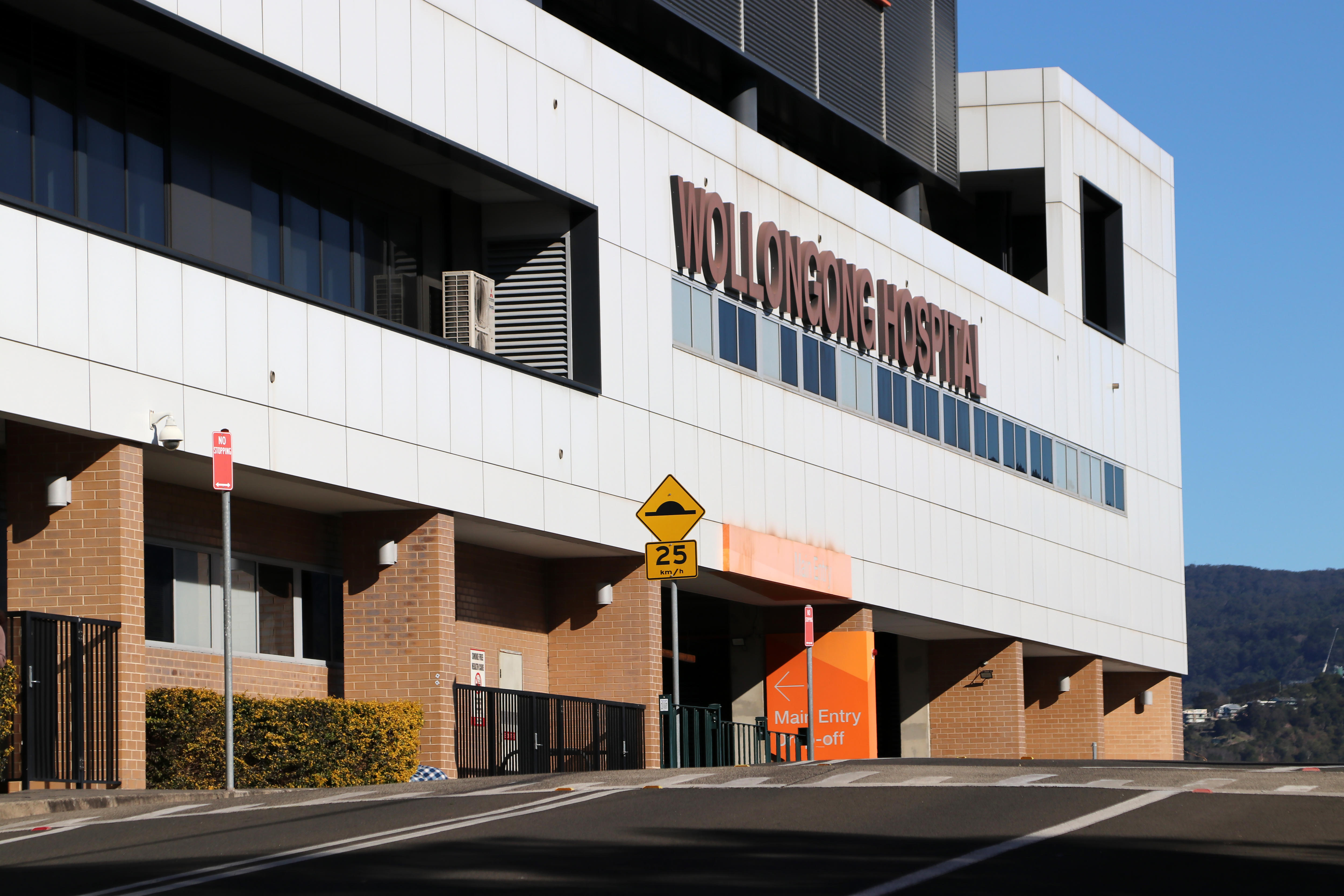 outside building with sign saying Wollongong Hospital