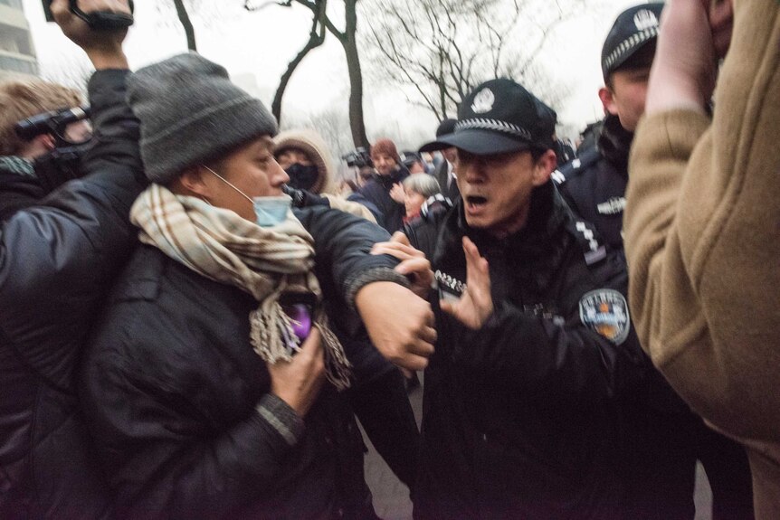 Chinese police push away journalists and supporters of human rights lawyer Pu Zhiqiang outside court