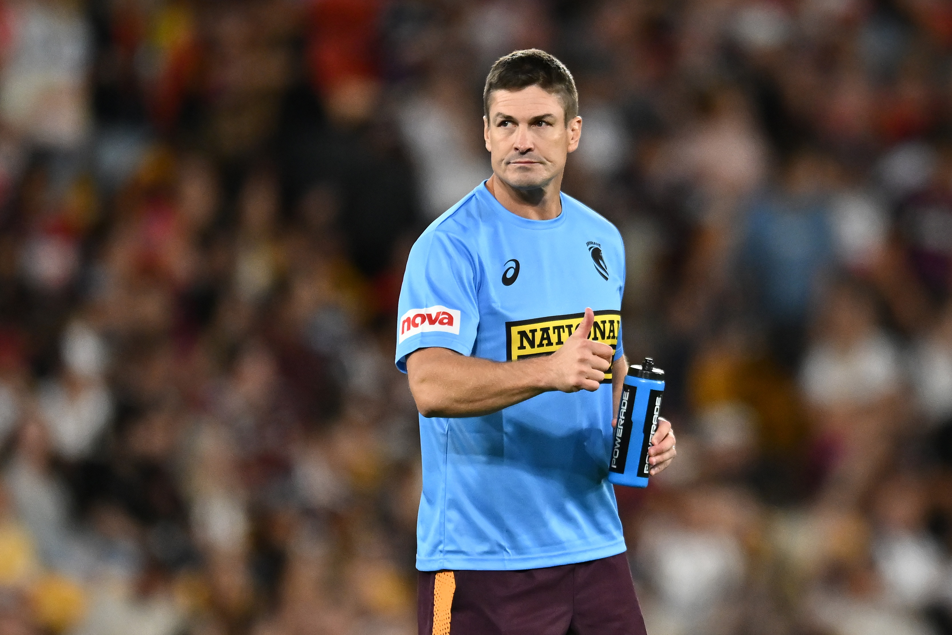 Matt Ballin with a thumbs up, running the water during an NRL match
