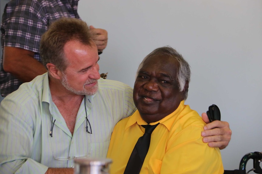 Nigel Scullion and Galarrwuy Yunupingu embrace at the ceremony.