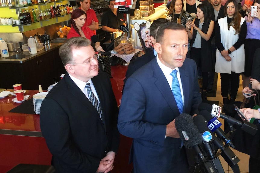 Bruce Billson and Tony Abbott talk to the media on May 21, 2015